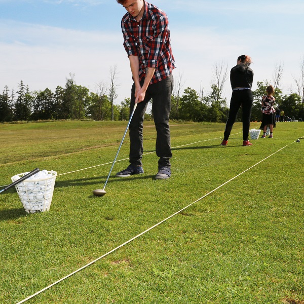 golfers practice on driving range at bruces mill conservation park