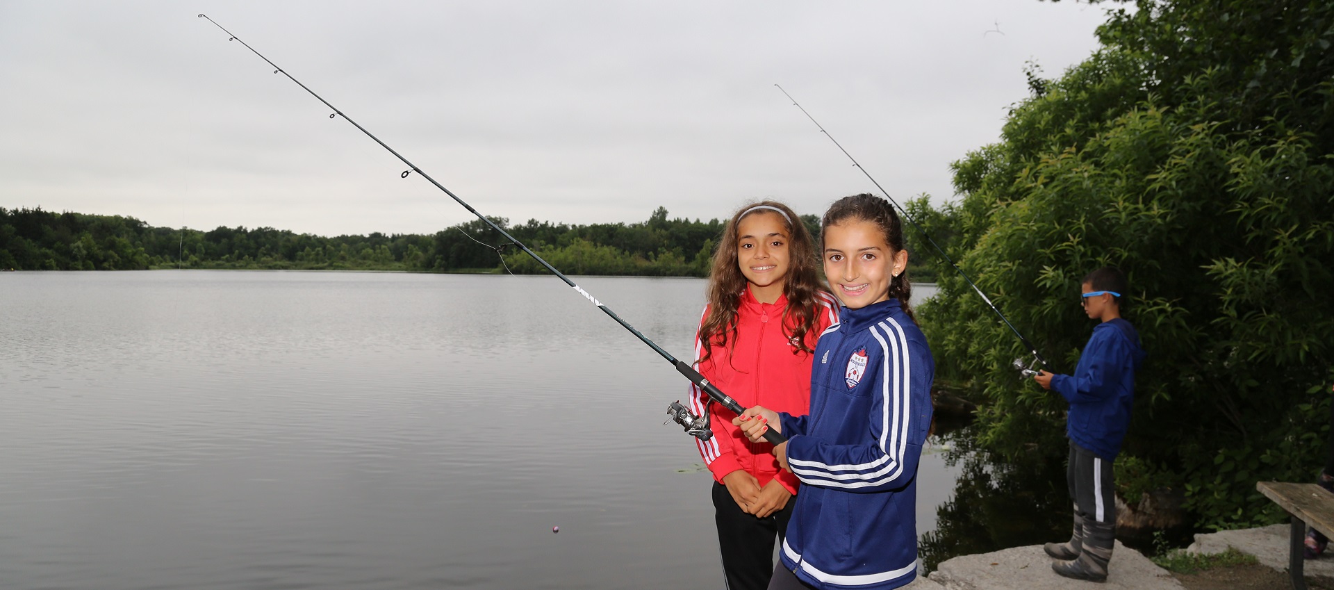 young girls fishing at heart lake conservation area