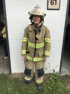 Young woman in a fire fighter's outfit