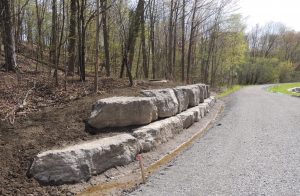 Armourstone wall and compacted gravel path base at Wilket Creek Park (Reach 2).