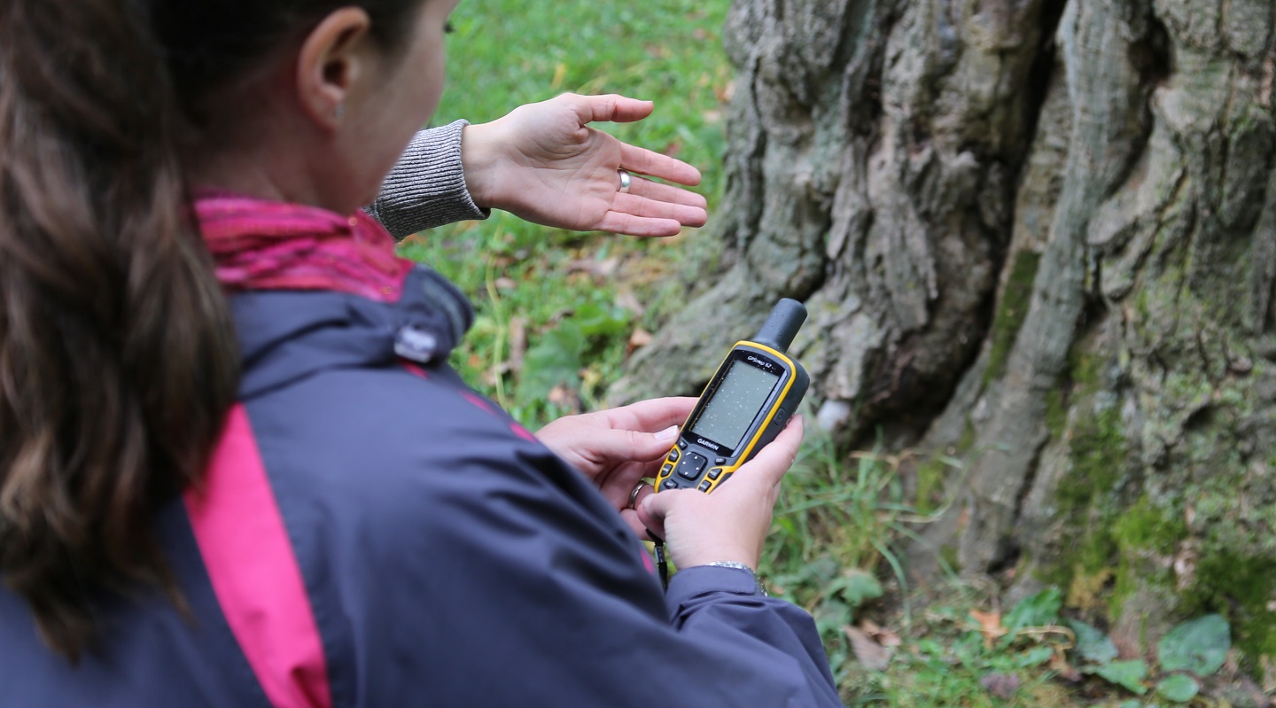 teachers use GPS device during orienteering workshop at Lake St George Field Centre