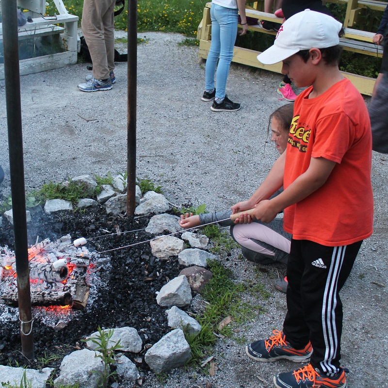 summer campers roast marshmallows at Albion Hills Field Centre