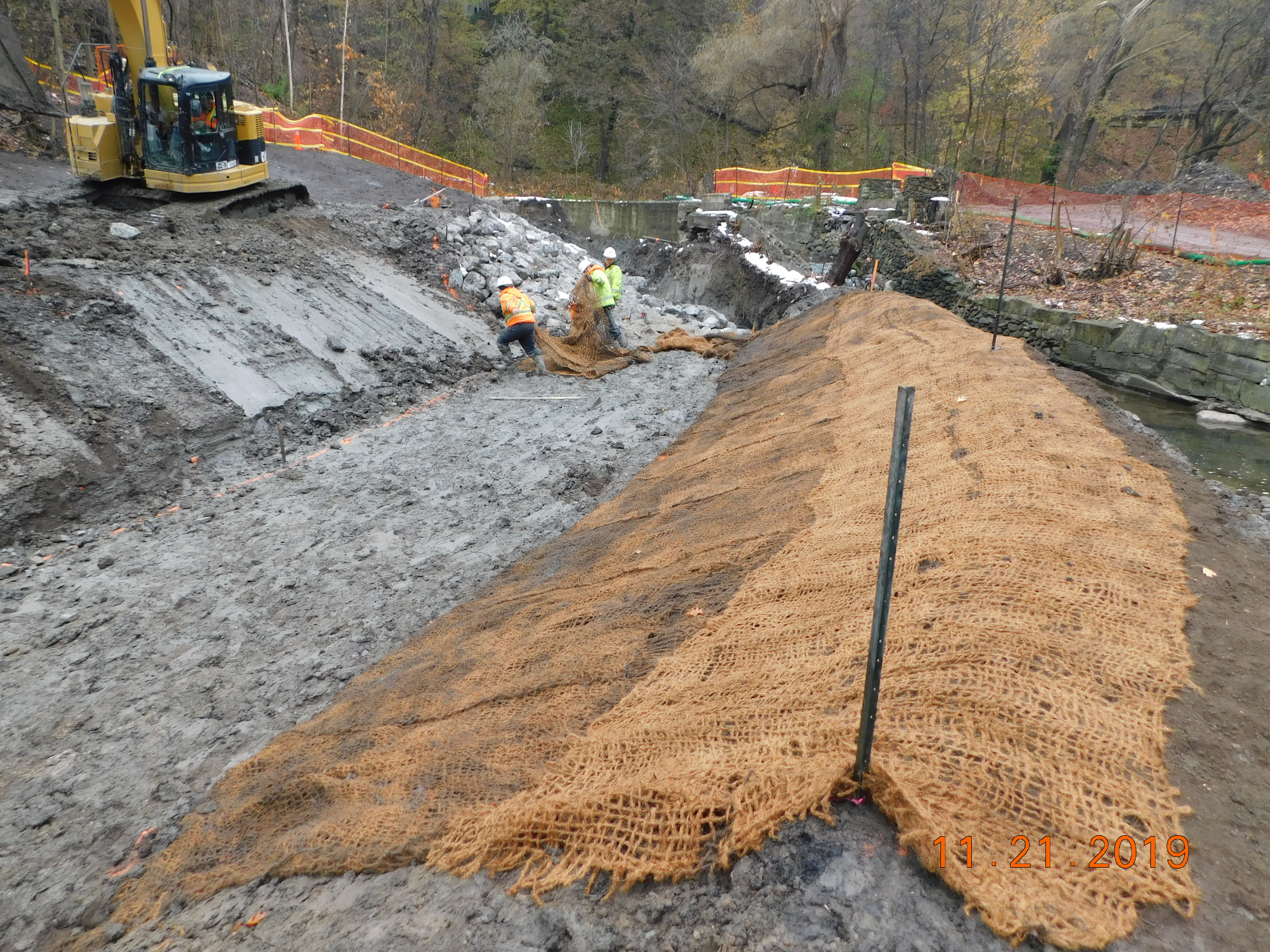 TRCA construction staff can been seen installing an erosion control blanket along the banks of the newly excavated Yellow Creek channel. Source: TRCA, 2019.