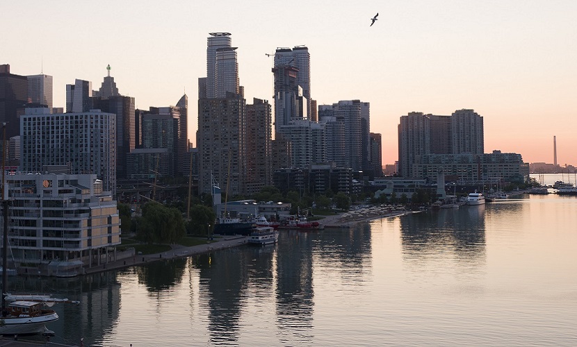 a view of the Toronto waterfront at sunset